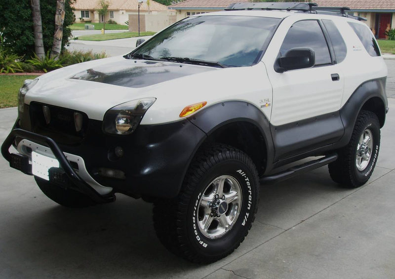 Illustration for article titled For $13,500, This 1999 Isuzu VehiCROSS Could Let You Pretend You're Robert Downey Jr… Or Ozzy Osbourne